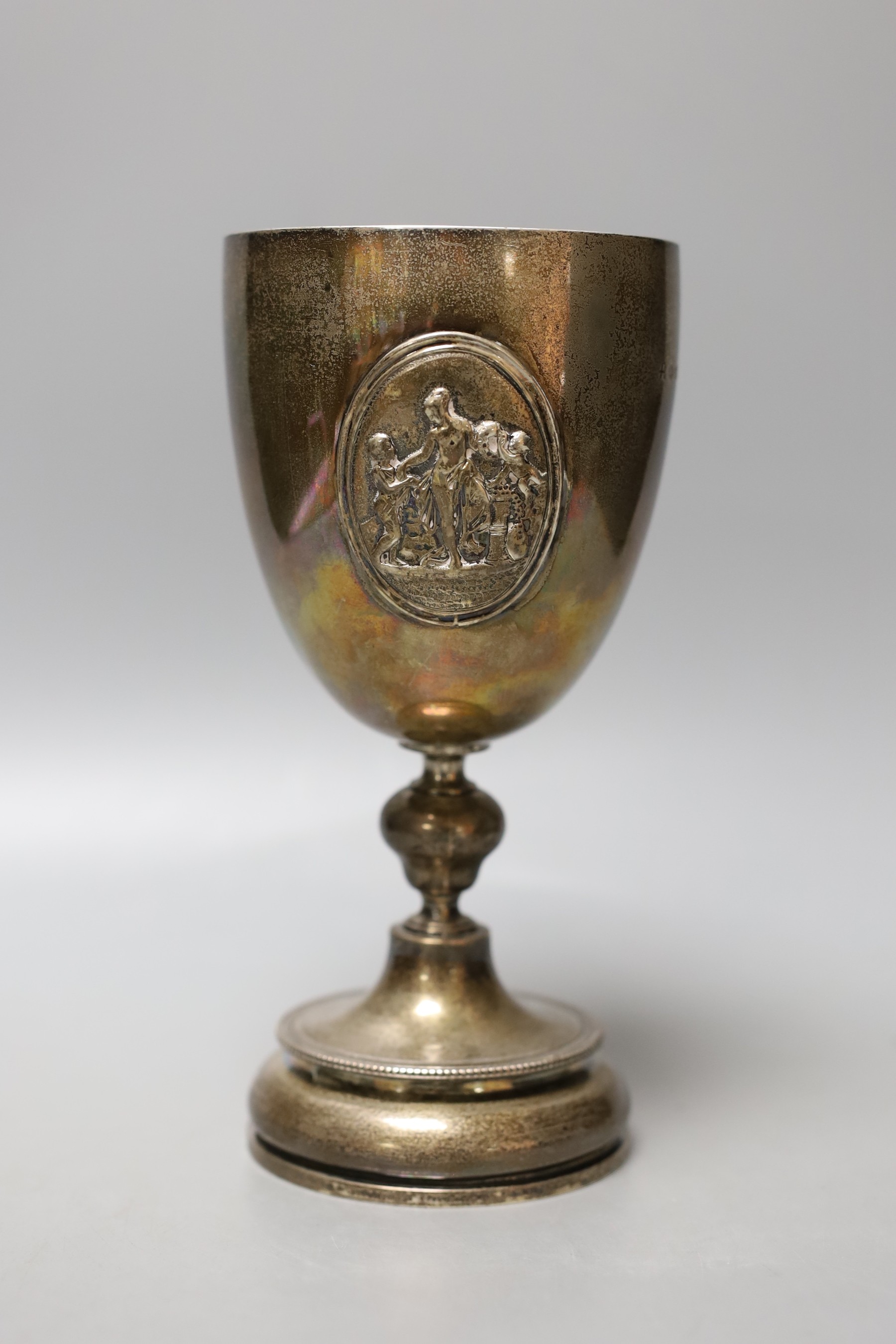 A Victorian silver presentation goblet, with engraved inscription and embossed panel, Daniel & Charles Houle, London, 1870, 19.6cm, 372 grams.